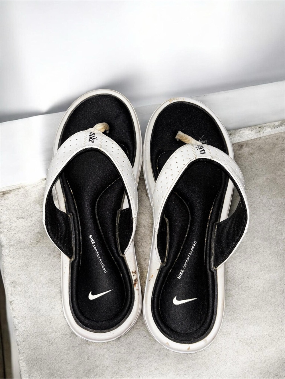 Well worn, used nike memory foam sandals